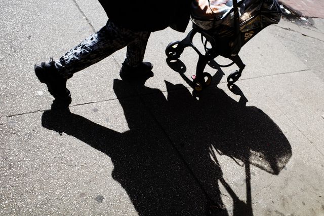 a stroller on a Manhattan sidewalk